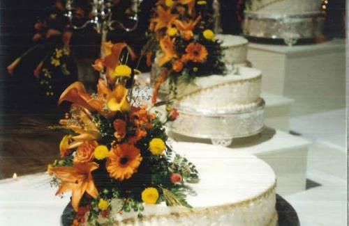Photo of a Wedding Cake with Orange Flowers